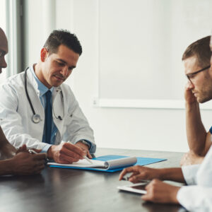 young,medical,personal,people,on,staff,meeting,sitting,in,front